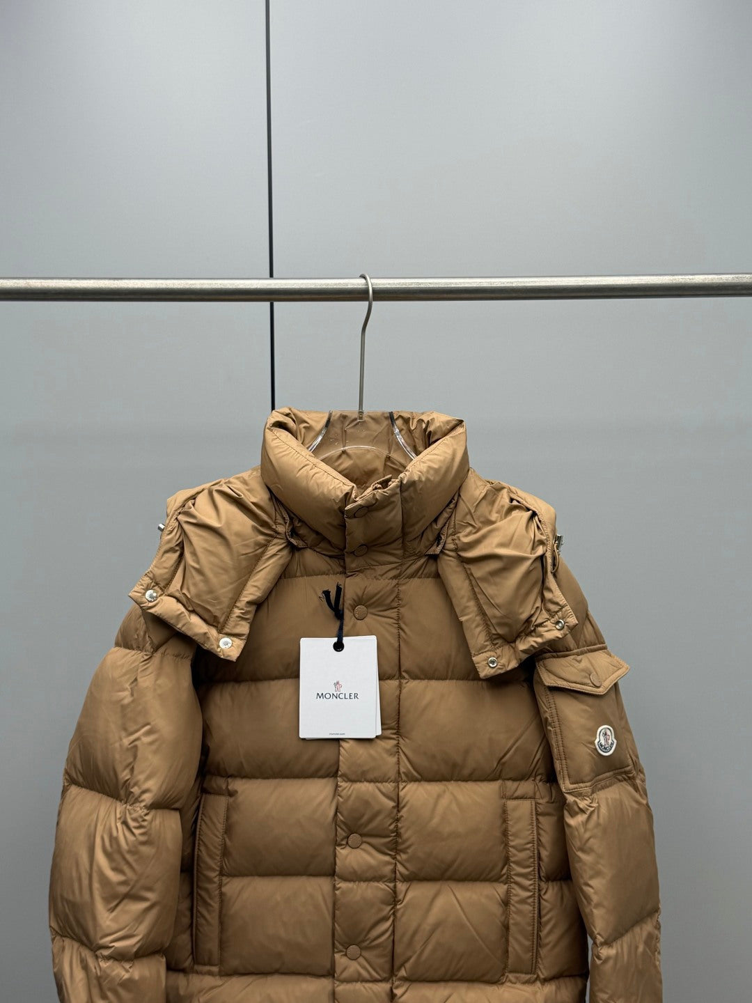 Moncler long puffer jacket in tan with hood and snap-button placket