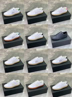 Low-top sneakers shown in multiple colors on black boxes, white lace fronts.
