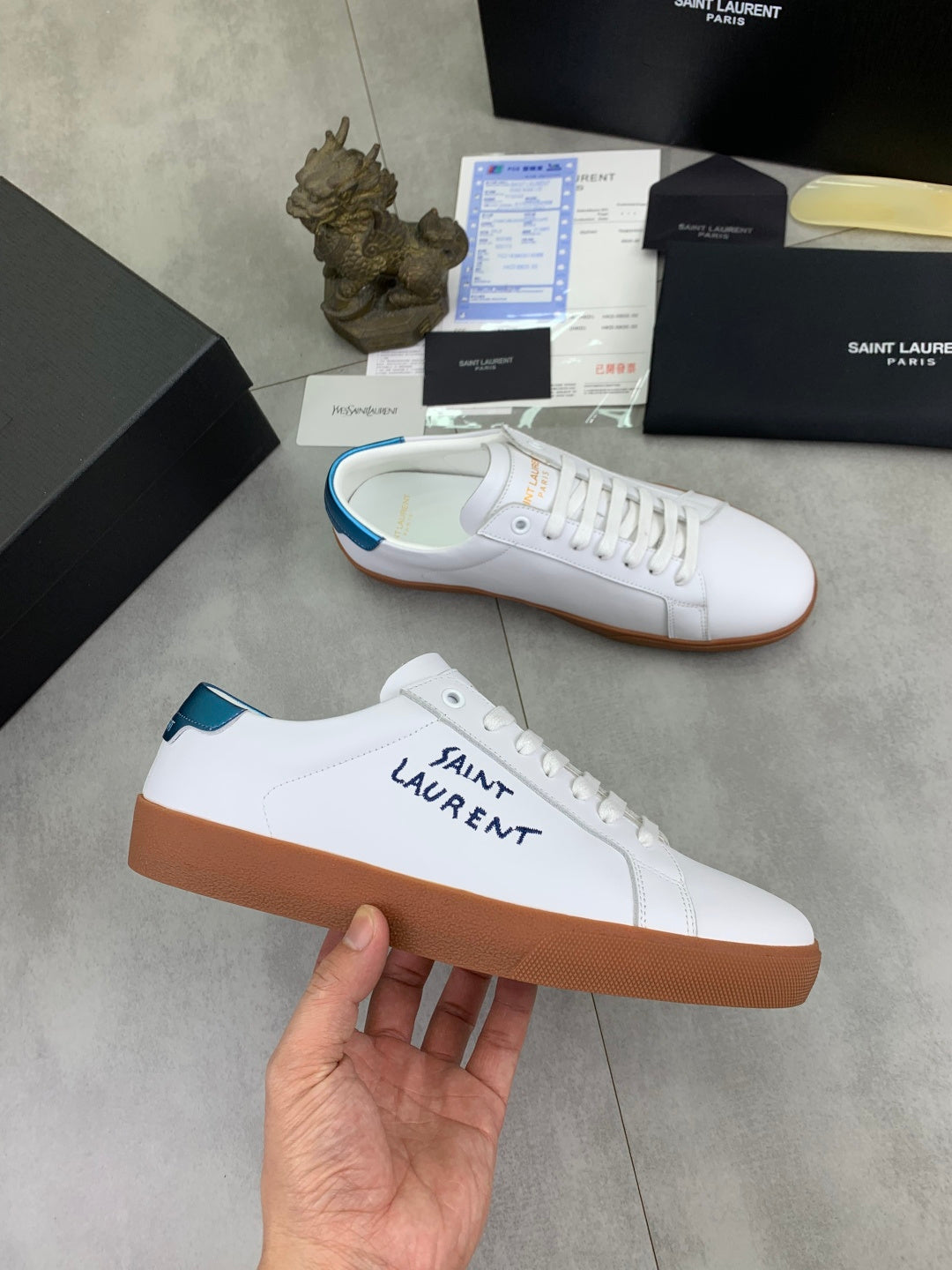 White leather sneaker with SAINT LAURENT logo and brown gum sole
