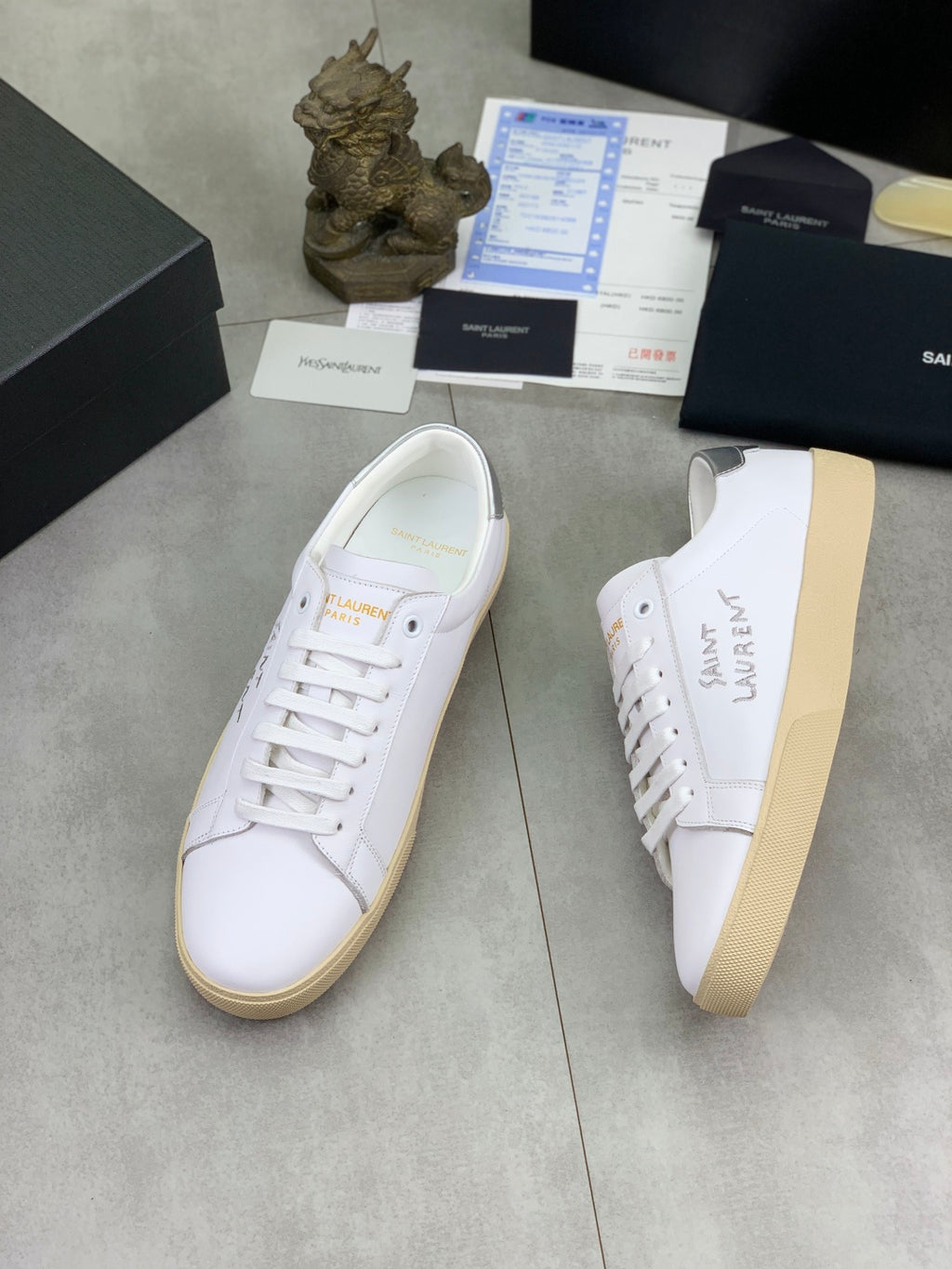 Luxury shoes, white leather look with lace-up and beige sidewall sole.