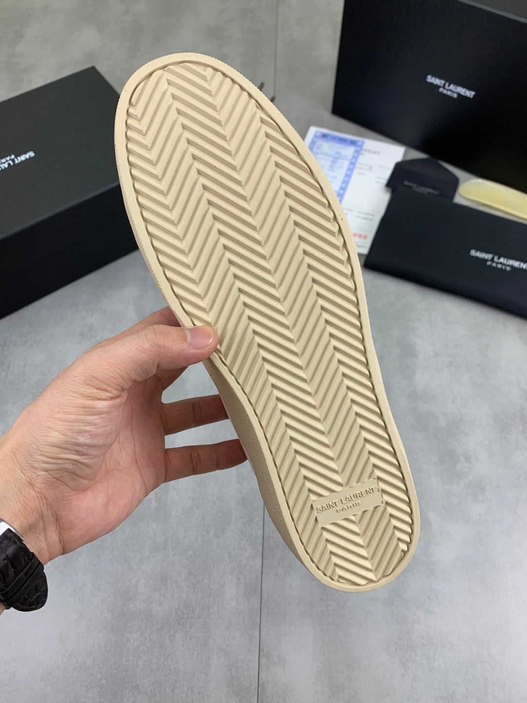 Luxury shoes outsole with herringbone tread in beige.