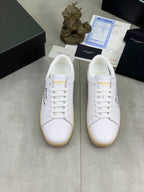 Pair of white YSL unisex lace-up sneakers with gum soles, front view