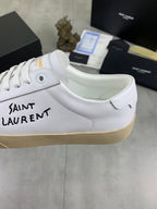 White YSL unisex sneaker with side logo, gum sole, lace-up front close view