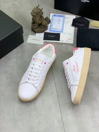 YSL unisex sneakers, white leather with pink heel tab, side view, gum sole