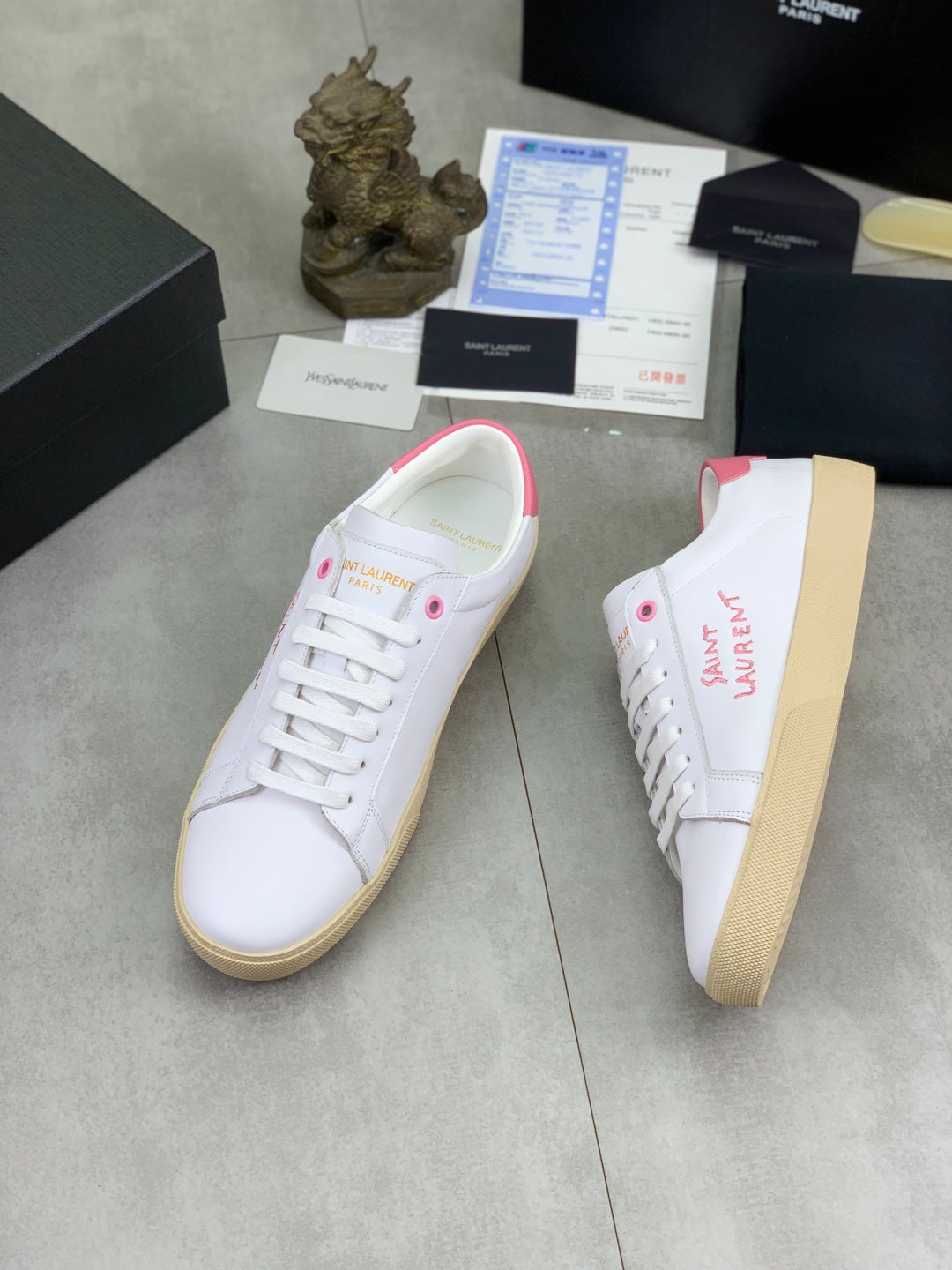 YSL unisex sneakers, white leather with pink heel tab, side view, gum sole