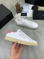 YSL unisex sneakers, hand-held view, white leather with pink collar and gum sole
