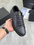 YSL sneakers in dark gray leather with lace-up front and round toe.