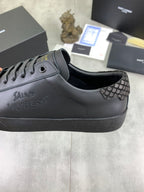 YSL sneakers with dark leather upper and patterned side panel near the eyelets.