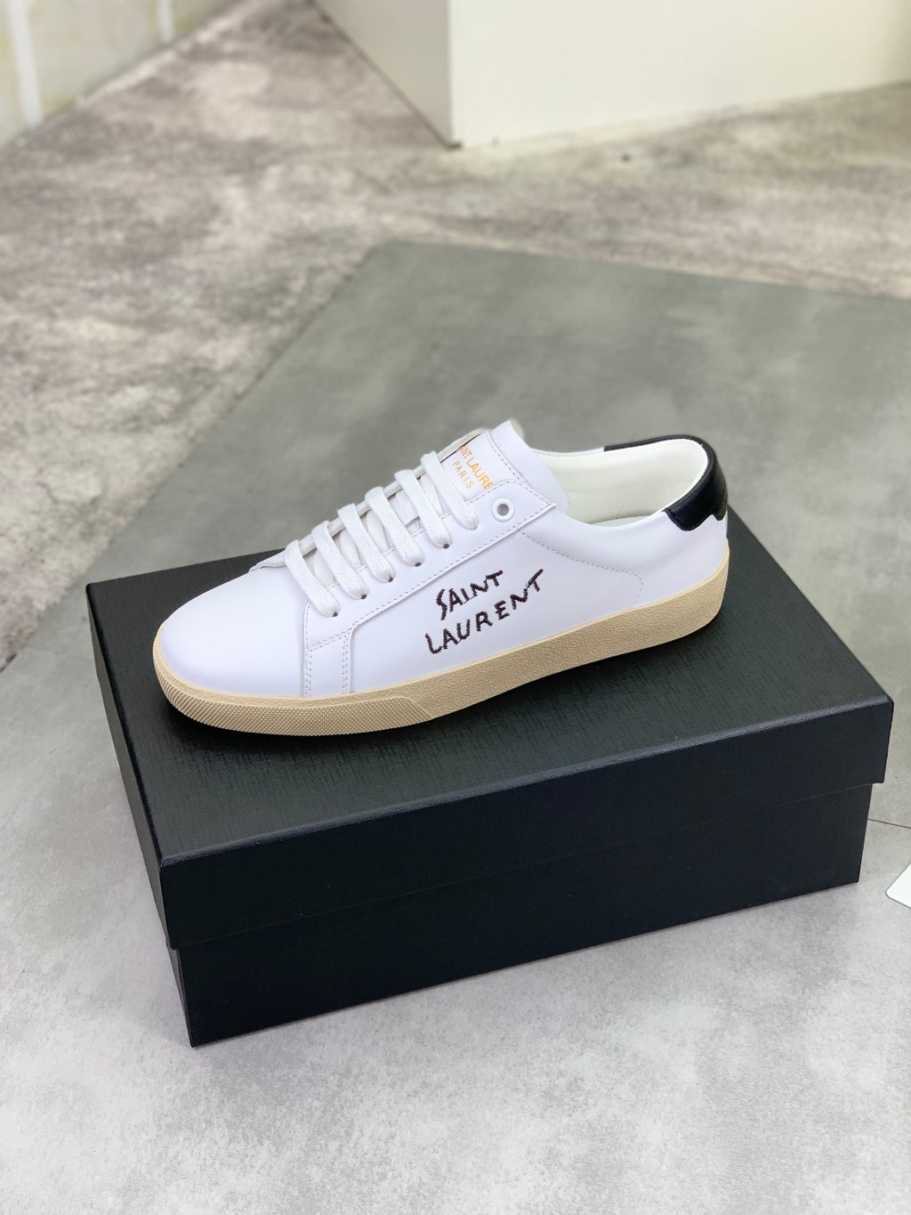 Saint Laurent unisex low-top sneakers on box, white with beige gum sole and laces