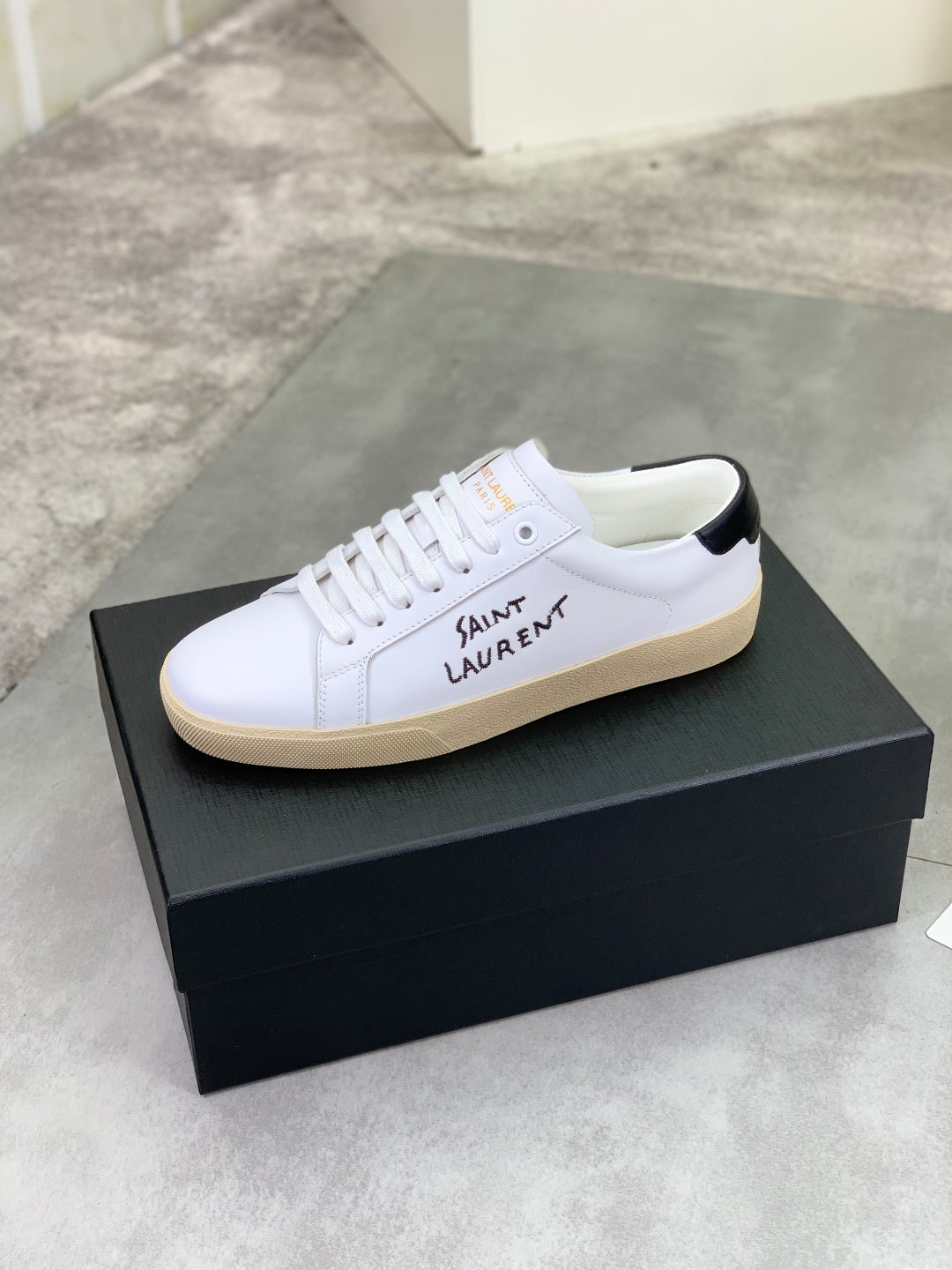 Saint Laurent unisex low-top sneakers on box, white with beige gum sole and laces