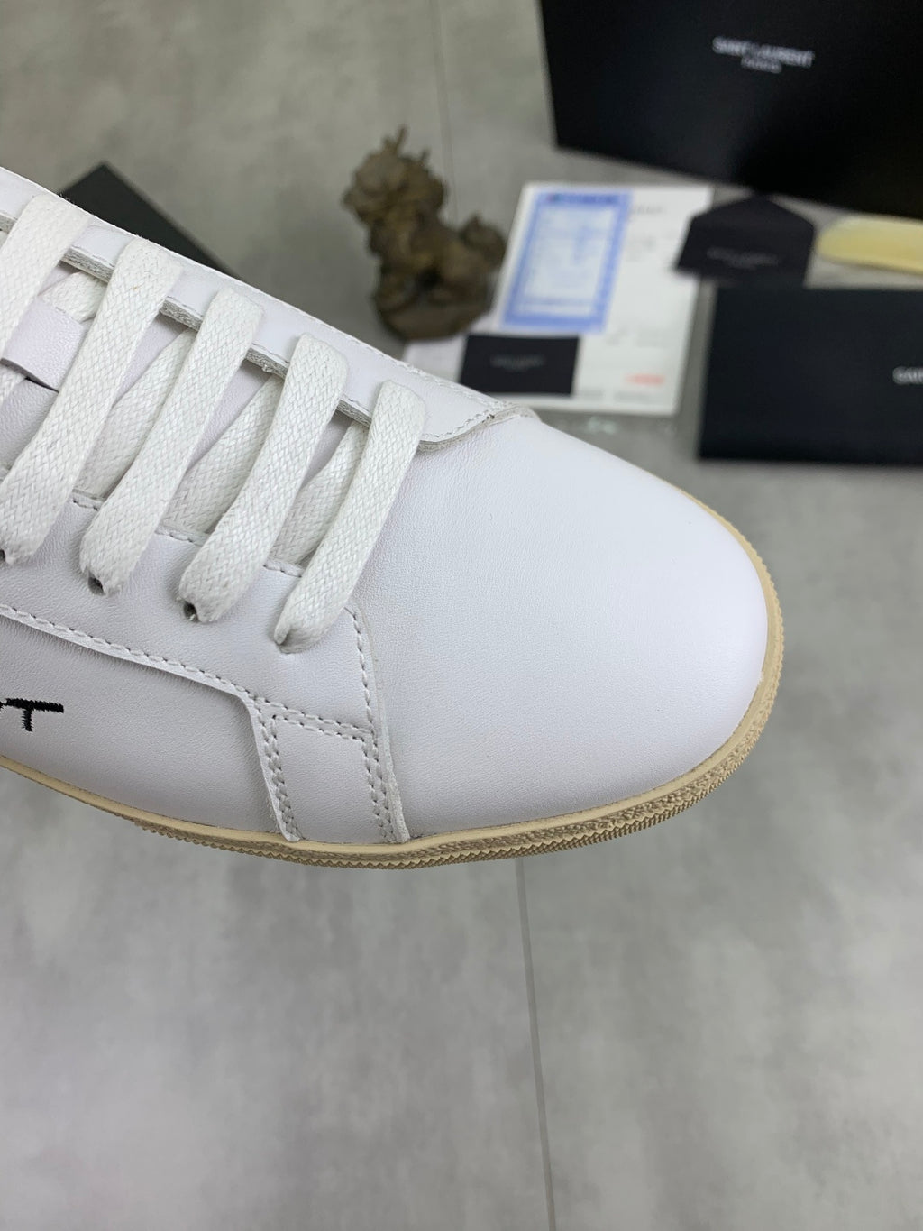 Saint Laurent unisex sneaker toe and laces, white upper with beige textured edge sole