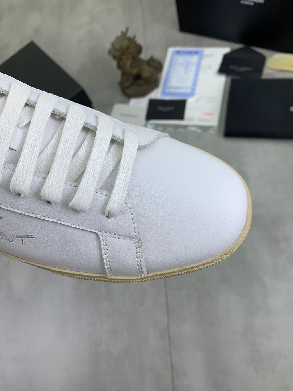 YSL unisex white leather sneaker with lace-up design and leopard side lining