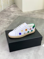 Unisex low-top sneakers with multicolor star patches and green-accented collar