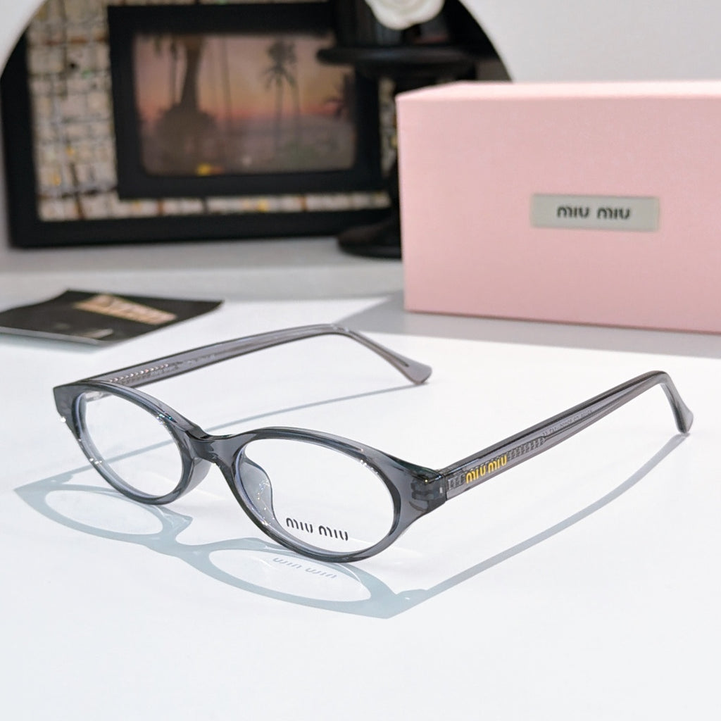 MiuMiu eyeglasses with dark gray frame and clear lenses, round oval front view