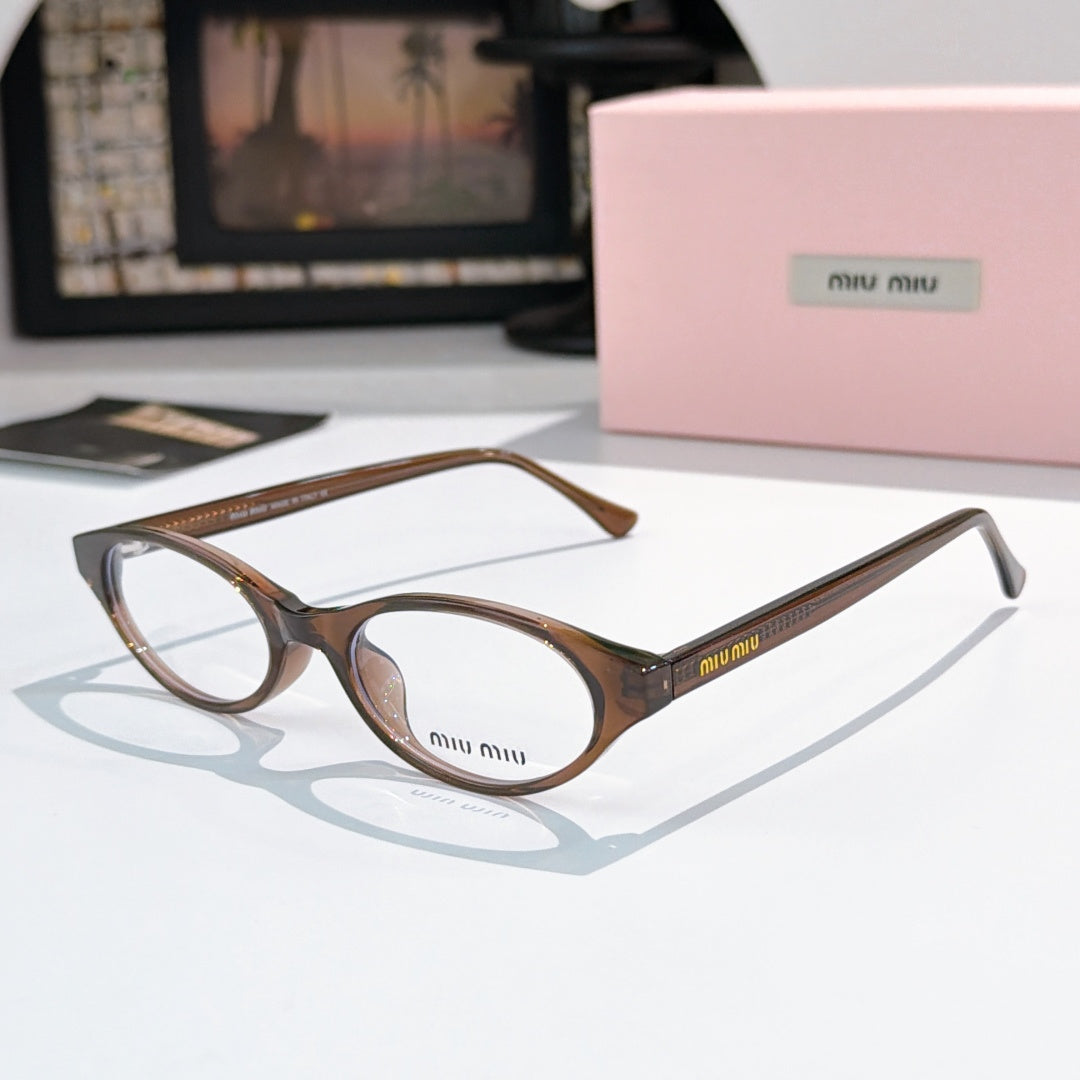 MiuMiu eyeglasses with brown and dark patterned frame and clear lenses, round oval view