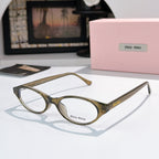 MiuMiu eyeglasses with olive-gold frame and clear lenses, round oval front view