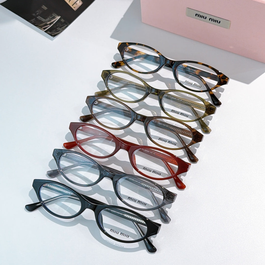 Set of MiuMiu eyeglasses with mixed frames, clear lenses shown in a diagonal stack