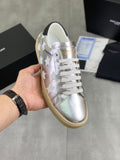 YSL unisex low-top sneakers in silver with white star overlays, white laces, gum sole