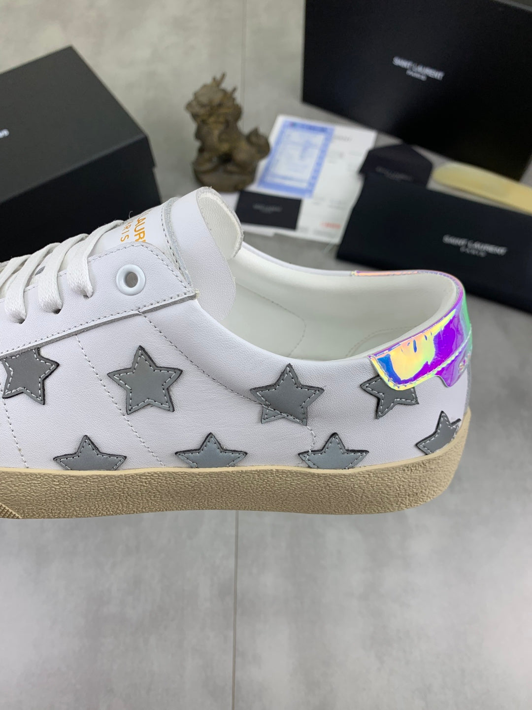 Unisex white sneakers with gray stars and iridescent heel collar trim