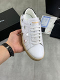 YSL unisex luxury shoes: white lace-up sneakers with star embroidery and tan sole