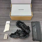 Balenciaga black lace-up sandals showing side profile and textured tread sole