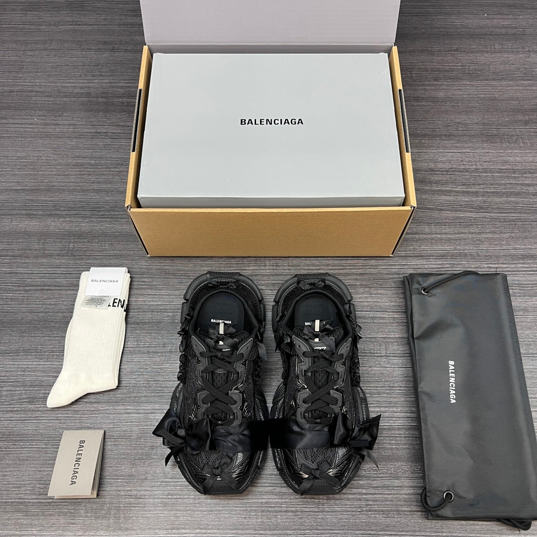 Balenciaga black lace-up sandals with layered straps and textured rubber sole