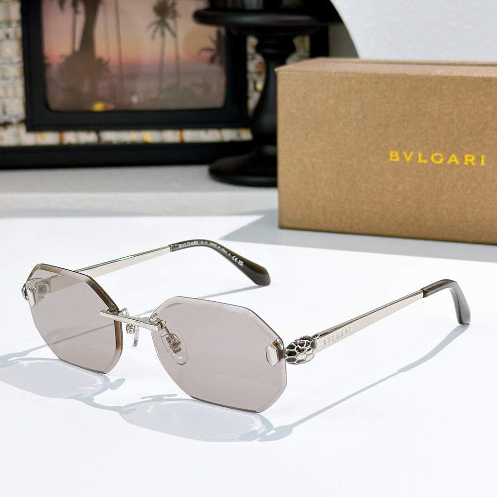 Gold-rimmed sunglasses with light pink-tinted lenses and slim angular temples