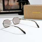 Silver-framed sunglasses with clear lenses and long angled temples