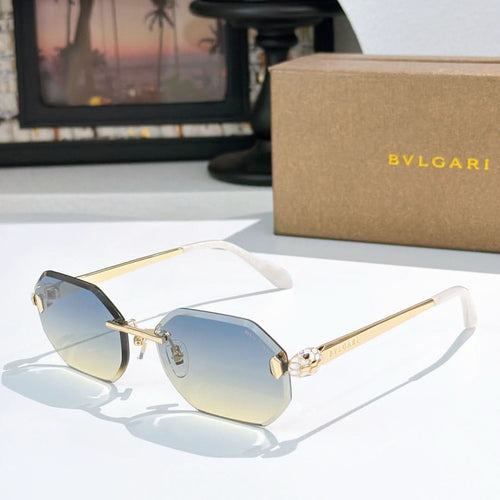 Gold-rimmed sunglasses with blue-tinted lenses and slim angular temples