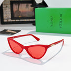 Cat-eye glasses with red frame and red tinted lenses