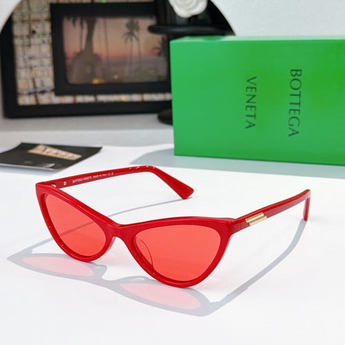 Cat-eye glasses with red frame and red tinted lenses