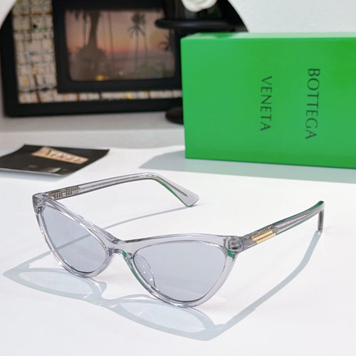 Cat-eye glasses with clear frame and light gray lenses