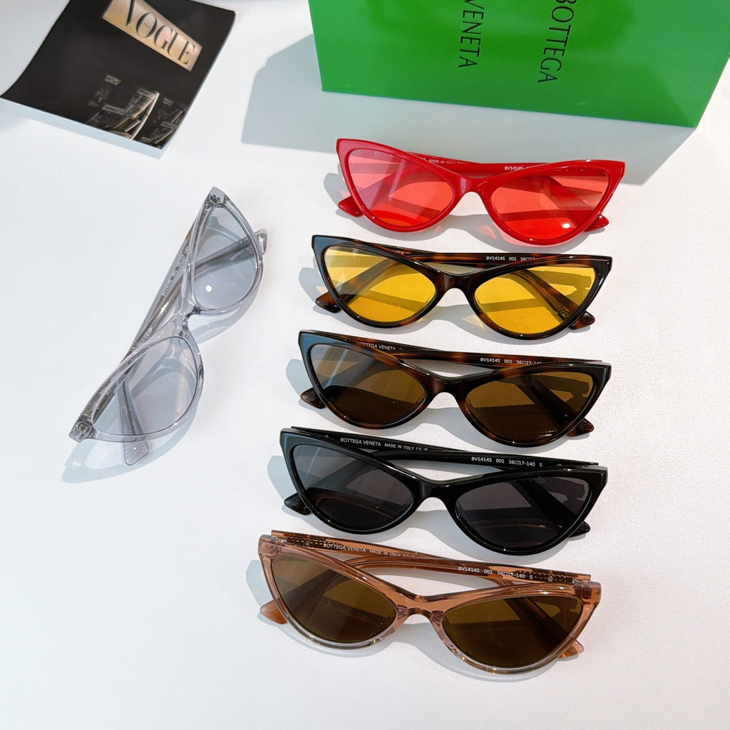 Set of cat-eye glasses with mixed frames and tinted lenses, stacked