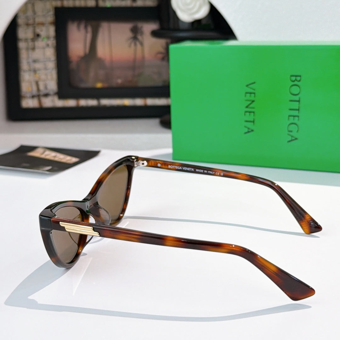 Cat-eye glasses in tortoiseshell with brown tinted lenses, side view