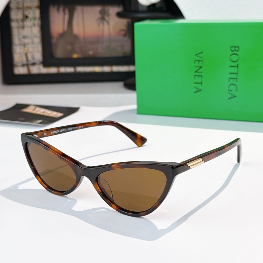 Cat-eye glasses with black frame and amber-brown tinted lenses