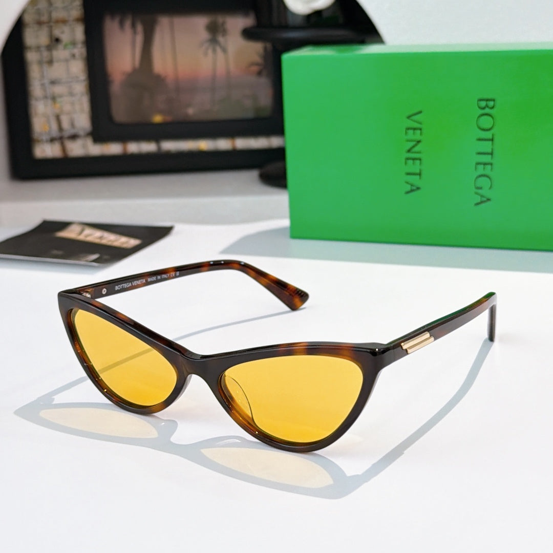 Cat-eye glasses with tortoiseshell frame and yellow tinted lenses