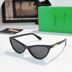 Cat-eye glasses with black frame and dark gray lenses