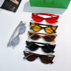 Set of cat-eye glasses in multiple colors, stacked with colored lenses