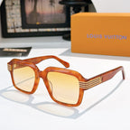 Designer sunglasses, amber orange square frames with warm yellow-tinted lenses and gold striped temple detailing.