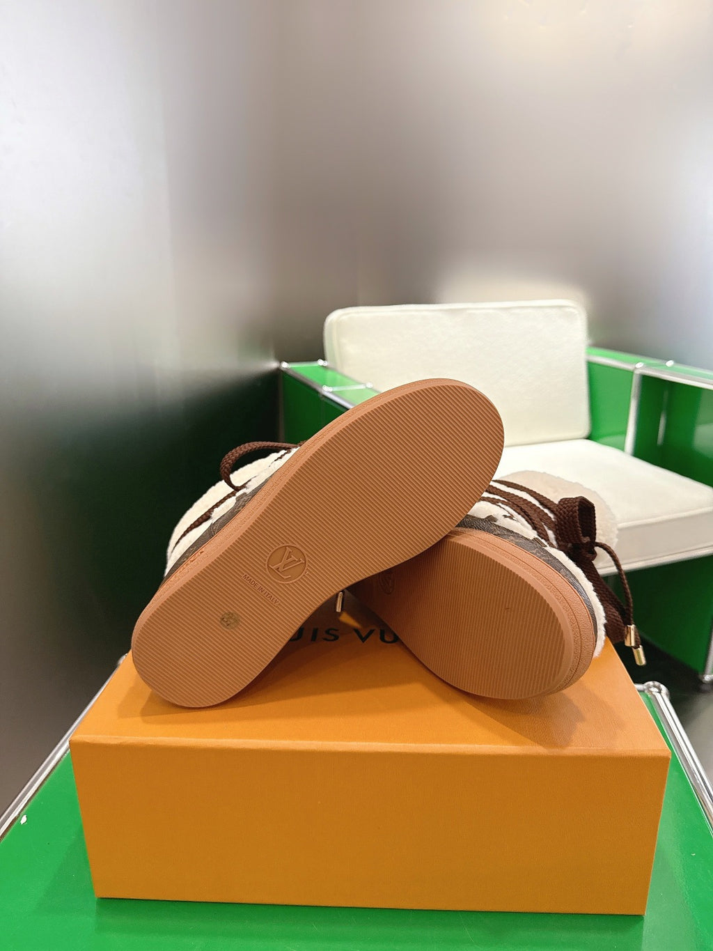 Louis Vuitton high-top sneakers outsole view, light brown rubber sole on display box