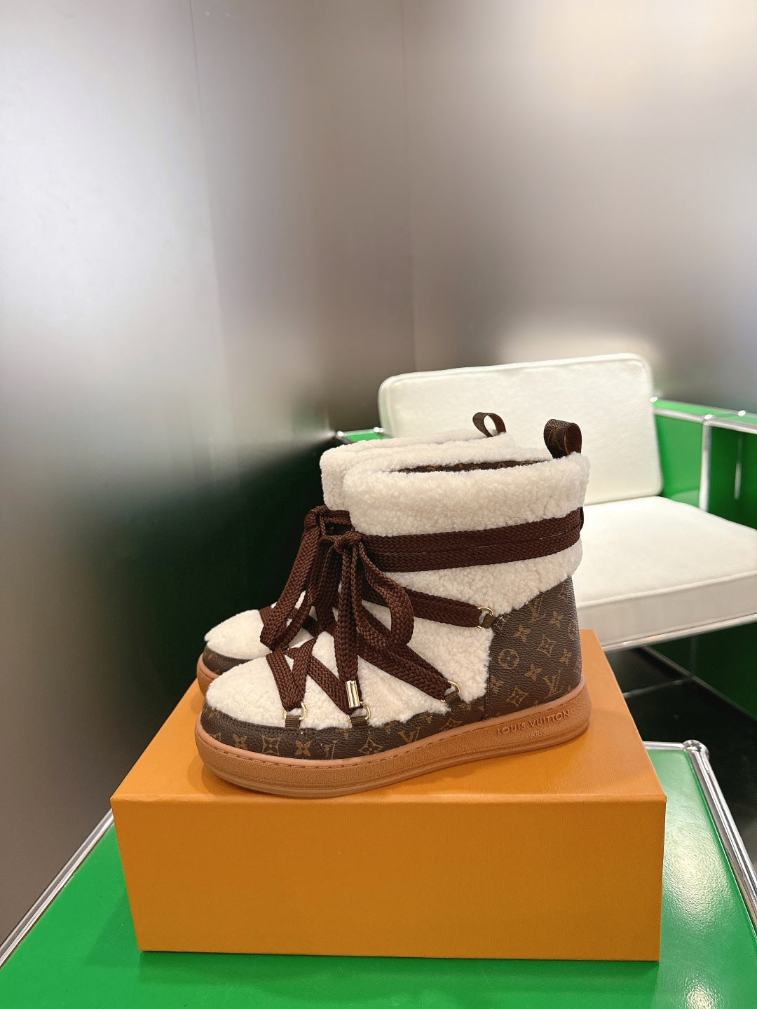 Louis Vuitton high-top sneakers with brown monogram panels and white fleece trim