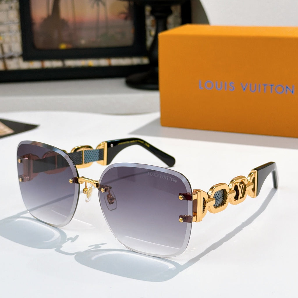 Sunglasses with violet-tinged lenses, dark frame, and gold patterned temple bars