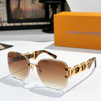 Sunglasses with warm brown lenses, tortoise-style frame, and gold patterned temples