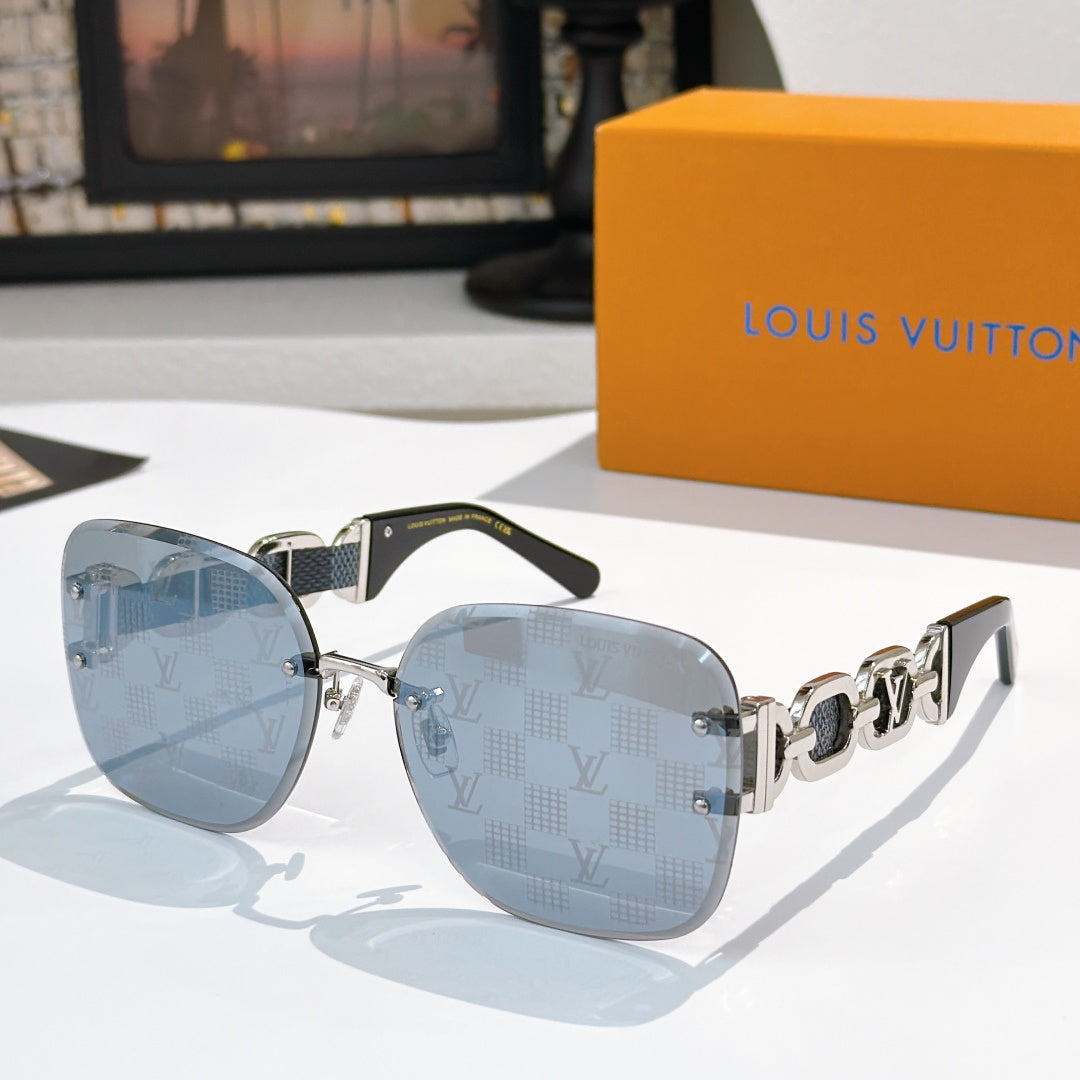 Sunglasses with light blue lenses, dark frame, and patterned temple bars