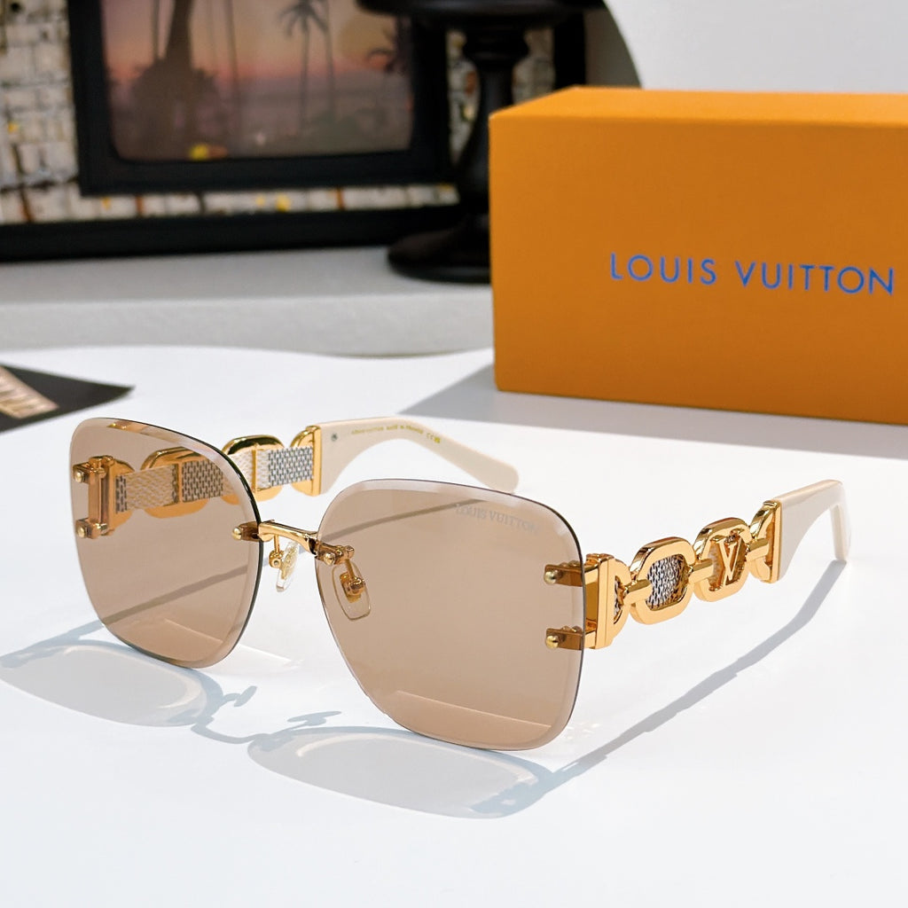 Sunglasses with light gold lenses, white frame, and gold patterned temple bars