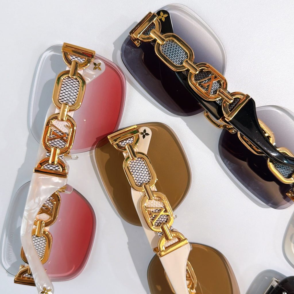 Sunglasses temples with Louis Vuitton logo links and textured gold detailing