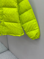 Neon green puffer jacket sleeve and hem with quilted padding and elastic cuff