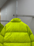 Back of long neon green puffer jacket with high collar and horizontal quilting