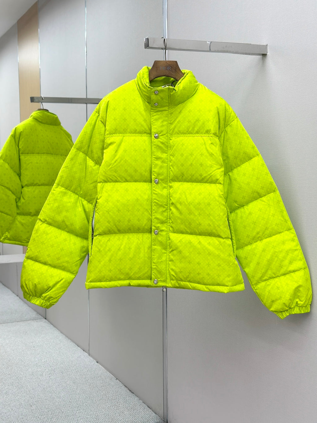 Long neon green puffer jacket with button-front and high collar