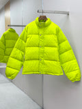 Long neon green puffer jacket with button-front and high collar